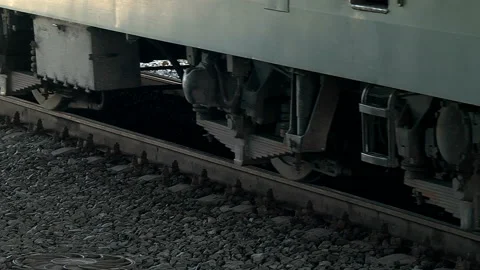 A freight train runs along the platform of the station Stock Footage 98118863