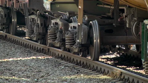 A freight train runs along the platform of the station Stock Footage 98120397