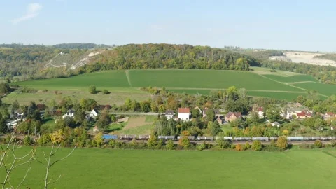 Freight train, Saale valley in autumn , Bad Ksen, Burgenlandkreis, Saxony-Anh Stock Footage 219324719