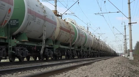 Freight train: sequence of dozens of open wagons and tank cars Stock Footage 62796354