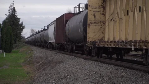 Freight train slow moving rust belt america Stock Footage 84314385
