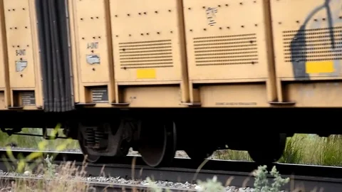 Freight train speeding down the tracks, shot 2. Stock Footage 79597023