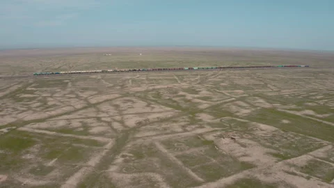 Freight train in the steppe Stock Footage 156328100