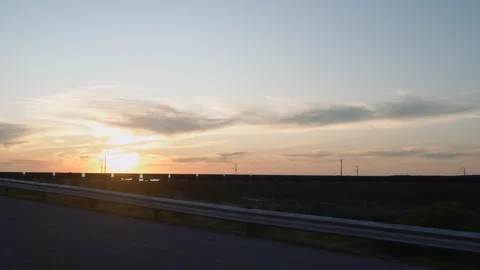 Freight train at sunset drive by Vídeos de archivo 345189805