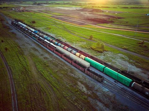 Freight train at sunset in nature.view from the throne. Stock Photos