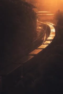 Freight train at sunset Stock Photos