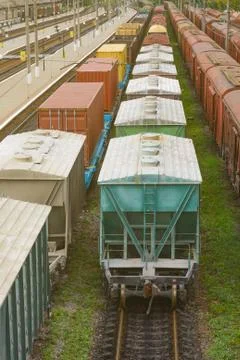 Freight train with tank wagons moving in forest. Green diesel cargo locomotiv Stock Photos