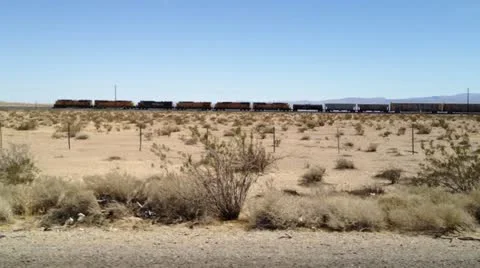 Freight train through desert -1 Stock Footage 10912984