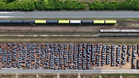 Freight train transporting cargo along industrial railroad tracks Stock Footage 335977072