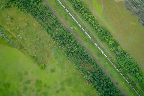 Freight train transporting raw industrial materials on railway line heavy cargo Stock Photos