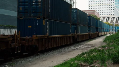 Freight Train Transporting Shipping Containers Through Urban Area, City Stock Footage 327704430