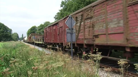 Freight train vintage goods wagons passing by - medium shot Stock Footage 74100415