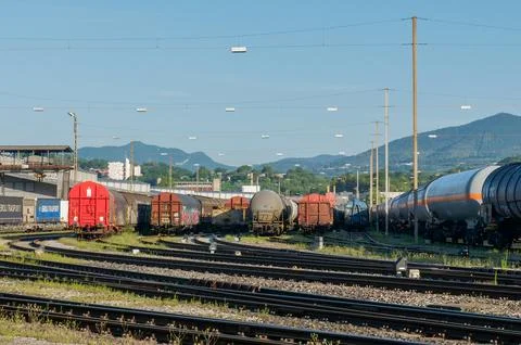 Freight train wagons and tank cars parked in rail marshalling yard in Chiasso Stock Photos
