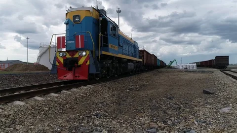 A freight train is waiting to load cargo Stock-Footage 128117704
