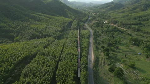 Freight Train Winds Through Mountains And Countryside Dak Lak Province Central Stock Footage 340178747