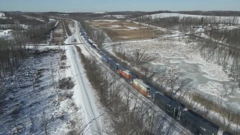 Freight Train in Winter Snow Rural Rochester County New York 動画素材 148735392