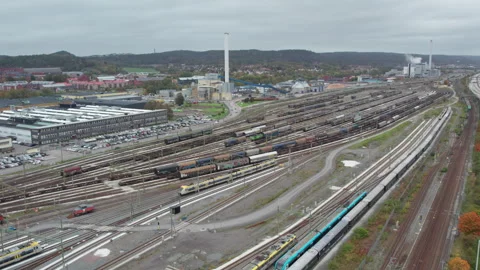 Freight trains and Passenger trains at Savenas train depot. Gothenburg, Aerial Stock-Footage 344638622