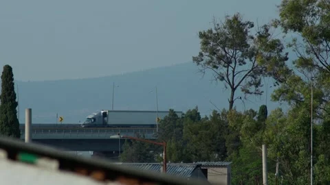 Freight transport traveling over an elevated bridge Stock Footage 276445243