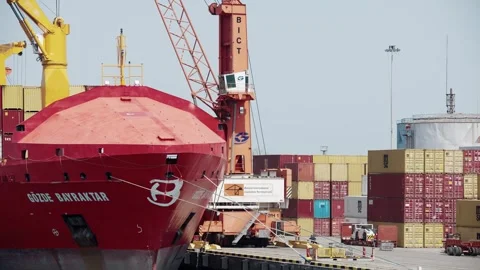 Freight transportation of containers on ship or cargo boat in harbor sea port Stock-Footage 258316340