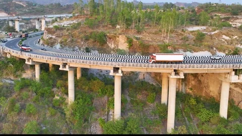 Freight truck driving on elevated highway curve. Stockbeeldmateriaal 335643341