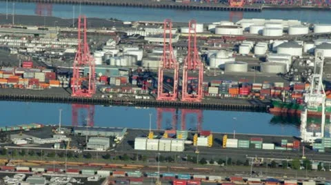 Freight Vessel Being Unloaded at Busy Harbor - Aerial View Stock Footage 11633735