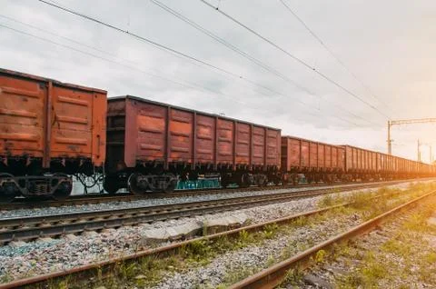 Freight wagons with solid cargo on the railway. Stock Photos