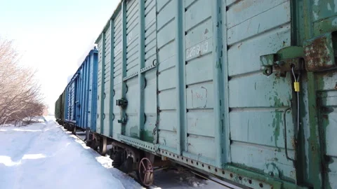 Freight wooden wagons of freight train at railway station in winter. Soviet Stock-Footage 170185142