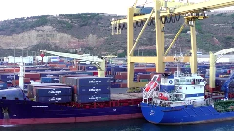 Freighter cargo shipping containers off load at port of Barcelona Spain Stock Footage 237836459