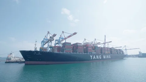 A freighter is docked at the port Stock Footage 118589905