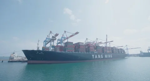 A freighter is docked at the port Stock Footage 118807781