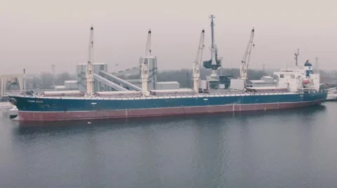 A freighter is loaded with grain at a grain terminal  at port of Riga Stock Footage 49093329