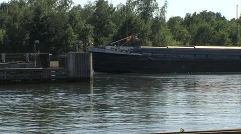 Freighter passing on channel Stock Footage 40237723