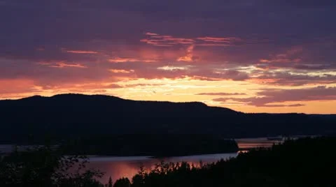 Freighter on a river at sunset Stock Footage