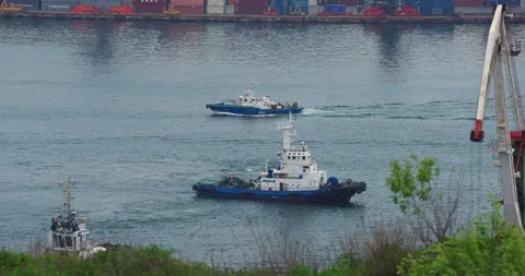 Freighter sails through tranquil sea wake fading gently Stock Footage 320774207
