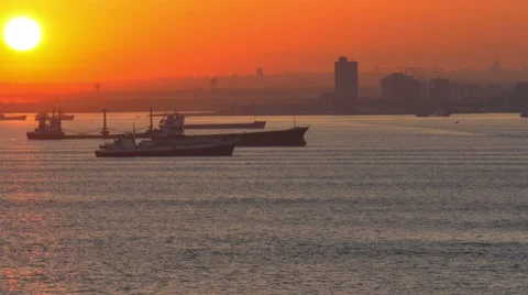Freighters cargo ships at sun down Bosporus Strait Istanbul, Turkey 4K  0761 Stock Footage 49347164