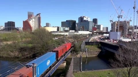 Freightliner train driving through Stratford Stock Footage 153337724