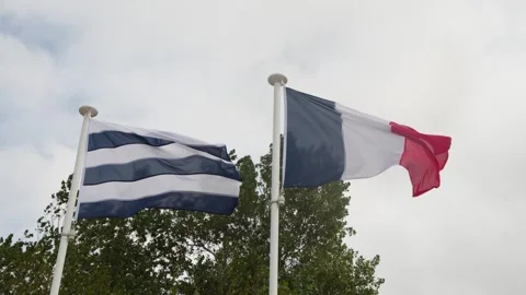 French and Breton Flags Fluttering in Wind at Dunkirk Memorial Stock Footage 324883670