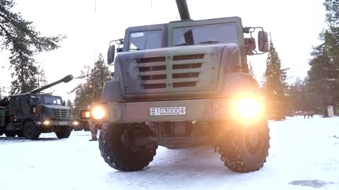 French Army 155mm Howitzer CAESAR vehicle driving over snow Stock Footage 291103302