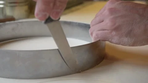 French bakery Chef cutting the dough in a circle Stock Footage 238501981