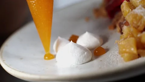 French bakery chef plating mango jelly dessert 스톡 동영상 238501876