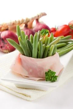 French beans with wrapped ham Stock Photos