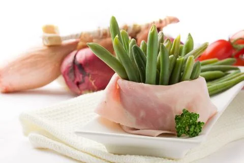 French beans with wrapped ham Stock Photos