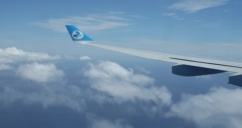 French Blue plane over ocean with clouds 스톡 동영상 90236369