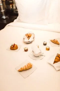 French breakfast in bed at hotel Stock Photos