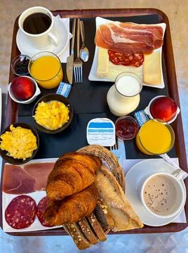 French Breakfast for two, cups of coffee, croissants, jam, fruits Stock Photos