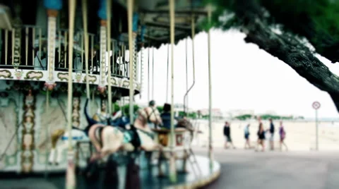 French Carousel On A Beach With Crowd Passing By Stock Footage 27633593