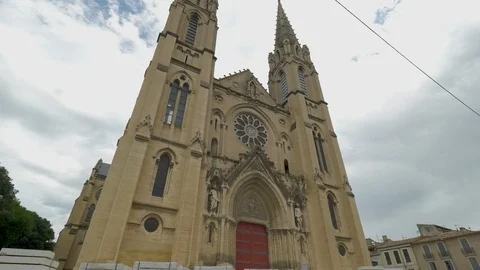 French Cathedral Saint Baudile Wide with big Red doors Stock-Footage 101201889