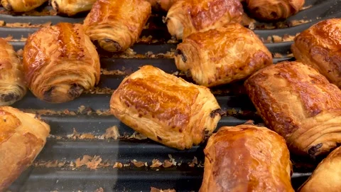 French chocolate bread on shelf from bakery. Tracking shot Stock Footage 303604687