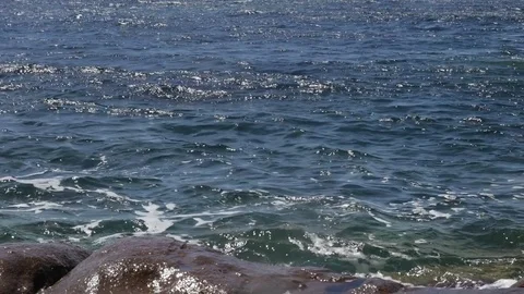 French coast rocks and blue water in slow motion video Stock Footage
