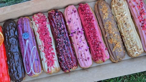 French colorful eclairs group dessert Stock Footage 158173003